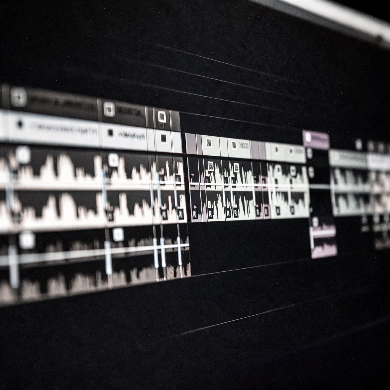 Monochrome editing timeline and cinematic frame grabs